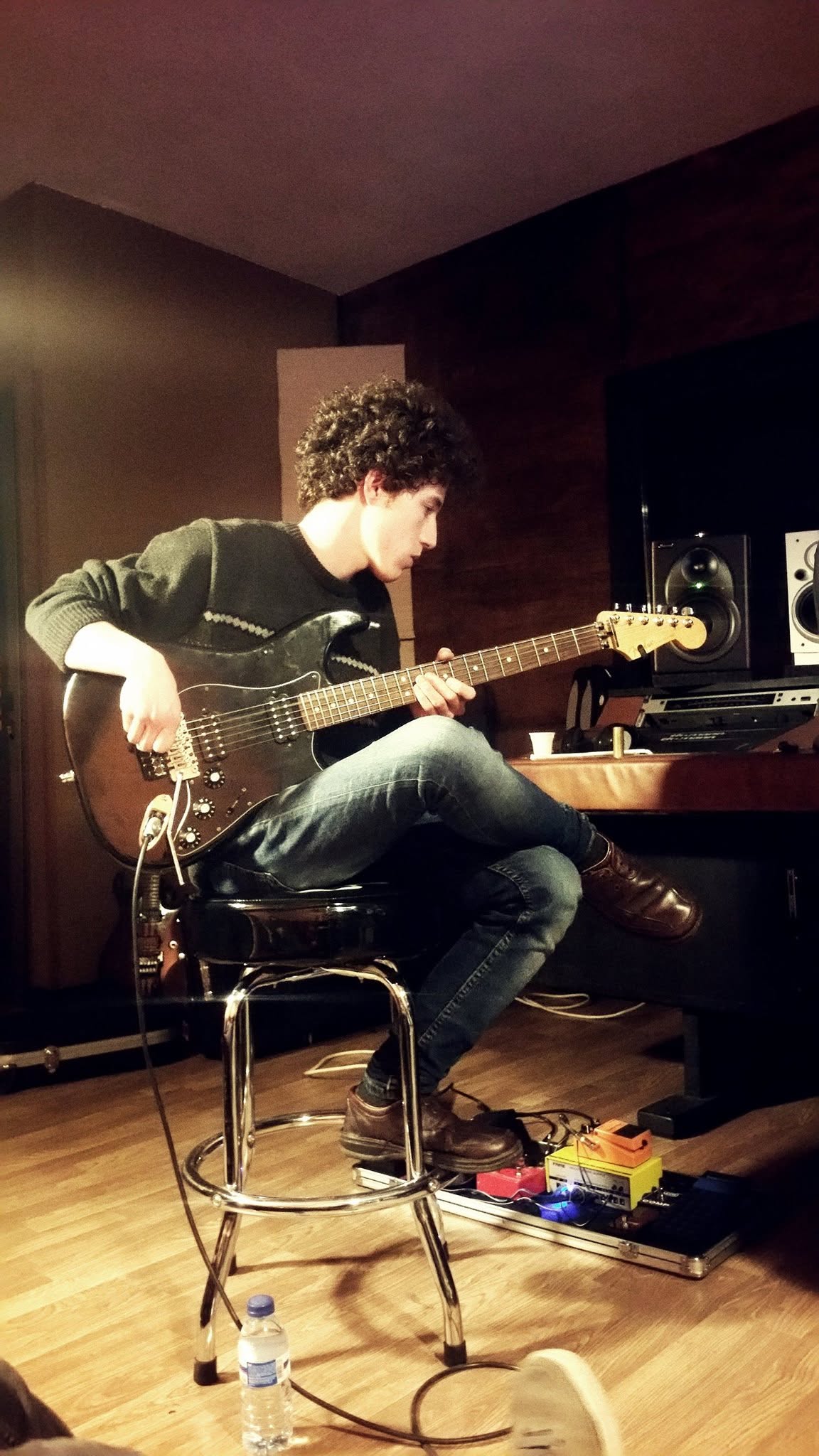Studio session photo of Rafael Xavier, the vocalist and lead guitarist of The Mouldy Cave Society recording guitar at Noise Magnet Studio in Guimarães, Portugal