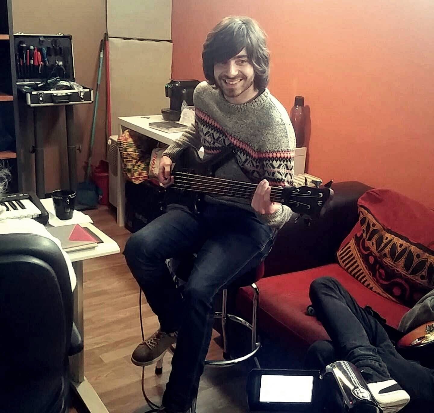 Studio session photo of Tiago Horta, the bass player and keyboardist of The Mouldy Cave Society recording bass at Noise Magnet Studio in Guimarães, Portugal
